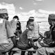 Black and white photo of people on a boat in Zanzibar, Tanzania.