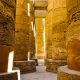Sunlit ancient columns in the historic Karnak Temple Complex in Luxor, Egypt.