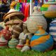 Brightly colored woven baskets displayed at a lively market in The Gambia.