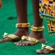 Close-up of traditional African attire and jewelry worn during a cultural festival in Accra, Ghana.